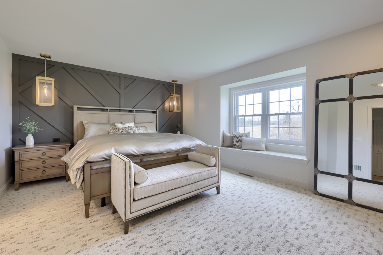 A serene master suite retreat built by ISM Construction with a spa-like bathroom, walk-in closet, and a bedroom designed for rest and relaxation.