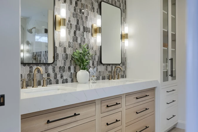 A finished bathroom remodel from an ISM Construction BSV project showcasing premium tile work, custom cabinetry, and spa-quality finishes throughout.