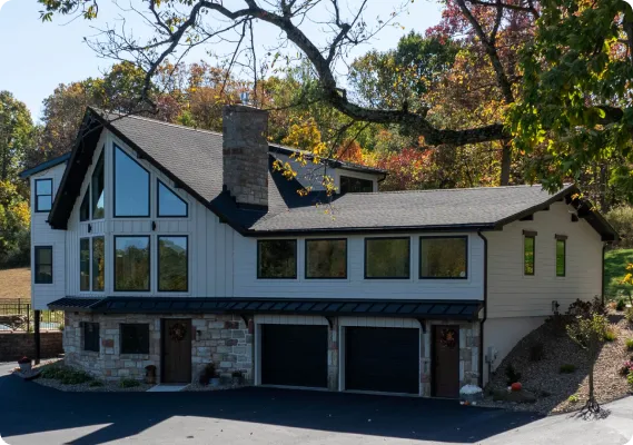A welcoming home entrance updated by ISM Construction featuring a classic front door that balances timeless charm with modern craftsmanship.