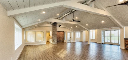 Large, open-concept commercial interior with vaulted ceilings and wood-look flooring, showcasing the work of ISM Construction, a General Contractor in Lebanon, PA.