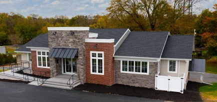 Aerial front view of a newly remodeled commercial brick and stone building, constructed by ISM Construction, a General Contractor in Lebanon, PA.