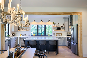A kitchen featuring a dining table surrounded by chairs, creating a cozy eating area.