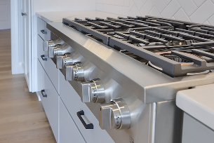 Professional-grade appliances seamlessly integrated into a custom kitchen remodel by ISM Construction, designed to match both cooking style and kitchen aesthetics.