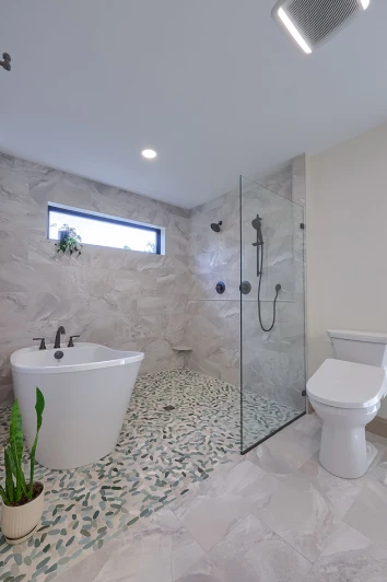 A beautifully remodeled bathroom by ISM Construction featuring designer fixtures, quality tilework, and a layout optimized for comfort and daily function.