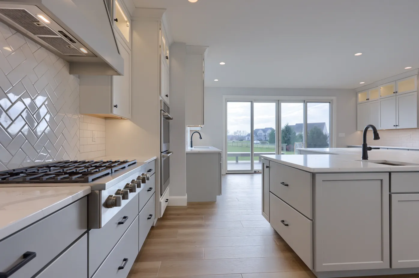 A chef-inspired custom kitchen by ISM Construction featuring custom cabinetry, professional-grade appliances, and a large center island.