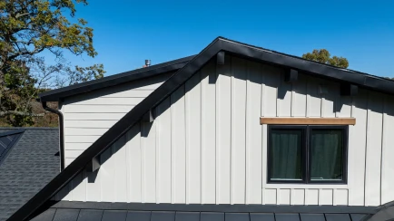 An exterior renovation by ISM Construction featuring new siding, energy-efficient windows, and a modern roof that respects the home's original architectural style.