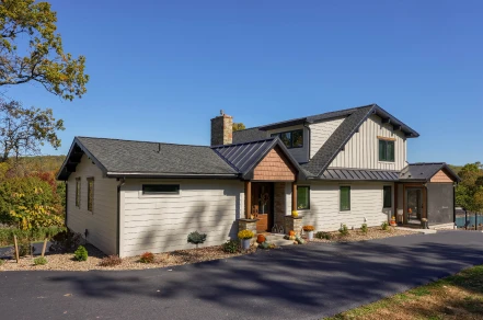 A Sunnyside Road home exterior remodeled by ISM Construction featuring premium siding, elegant stone accents, and crisp low-maintenance trim.
