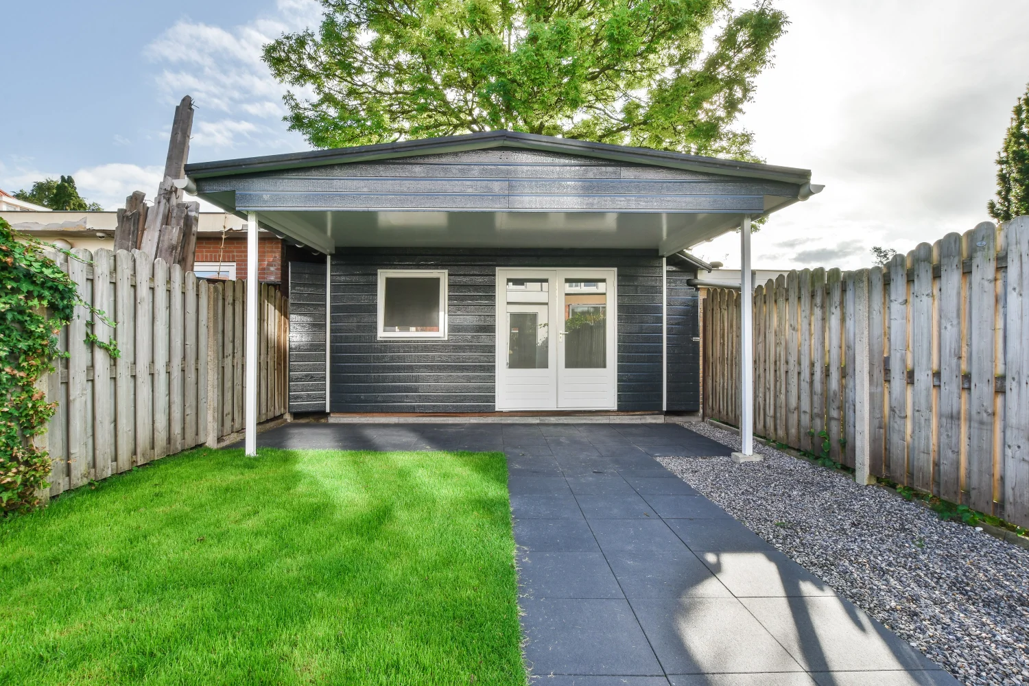 cozy backyard with covered patio and green lawn 2026 03 18 12 13 39 utc 1